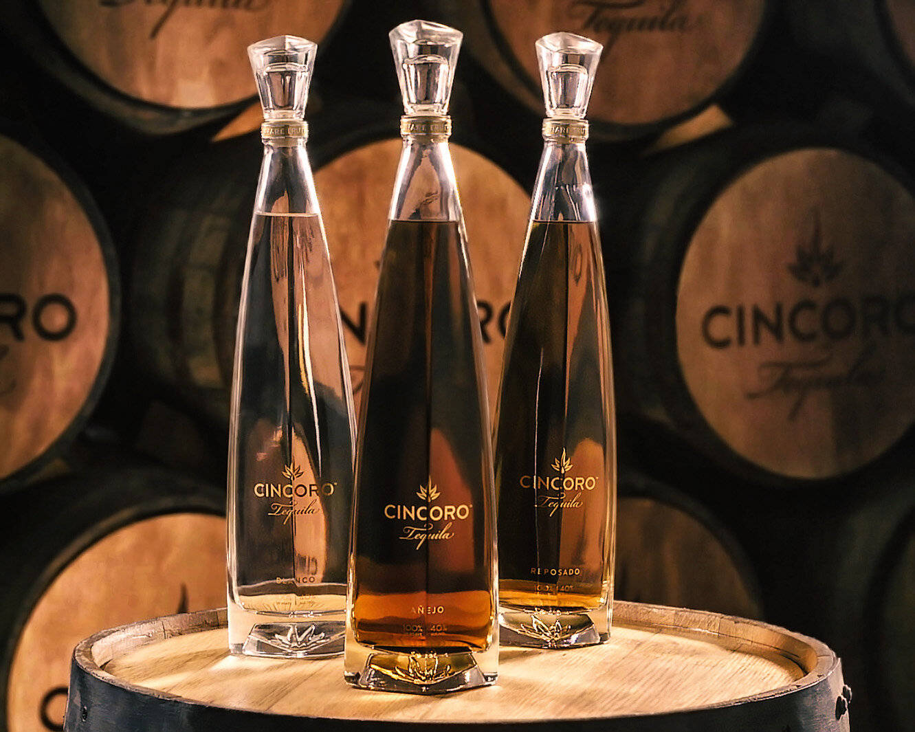 A Luxurious Experience - Cincoro Tequila Bottle Presented On A Wooden Cask Background