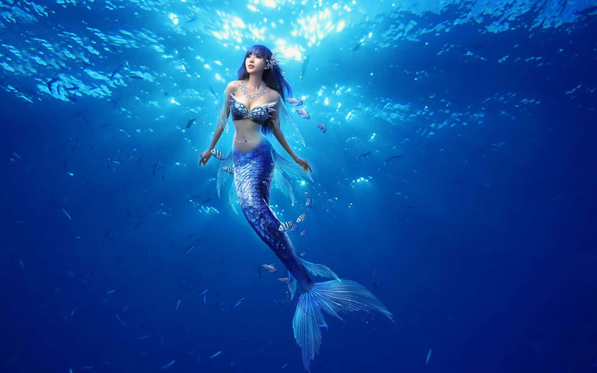 A Magnificent Mermaid Swimming Gracefully Through A Pool Of Shimmering Water.