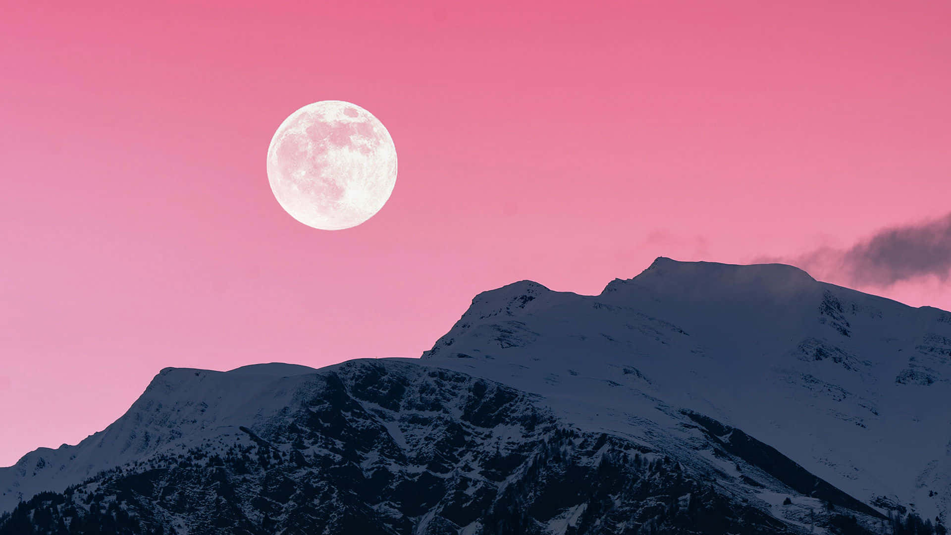 A Magnificent View Of A Pink Moon Appearing In The Star-filled Night Sky