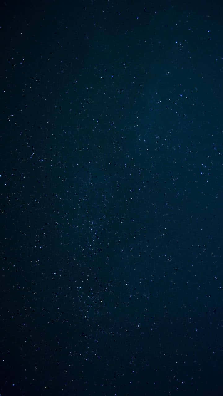 A Majestic Scene Of Stars And Galaxies Background