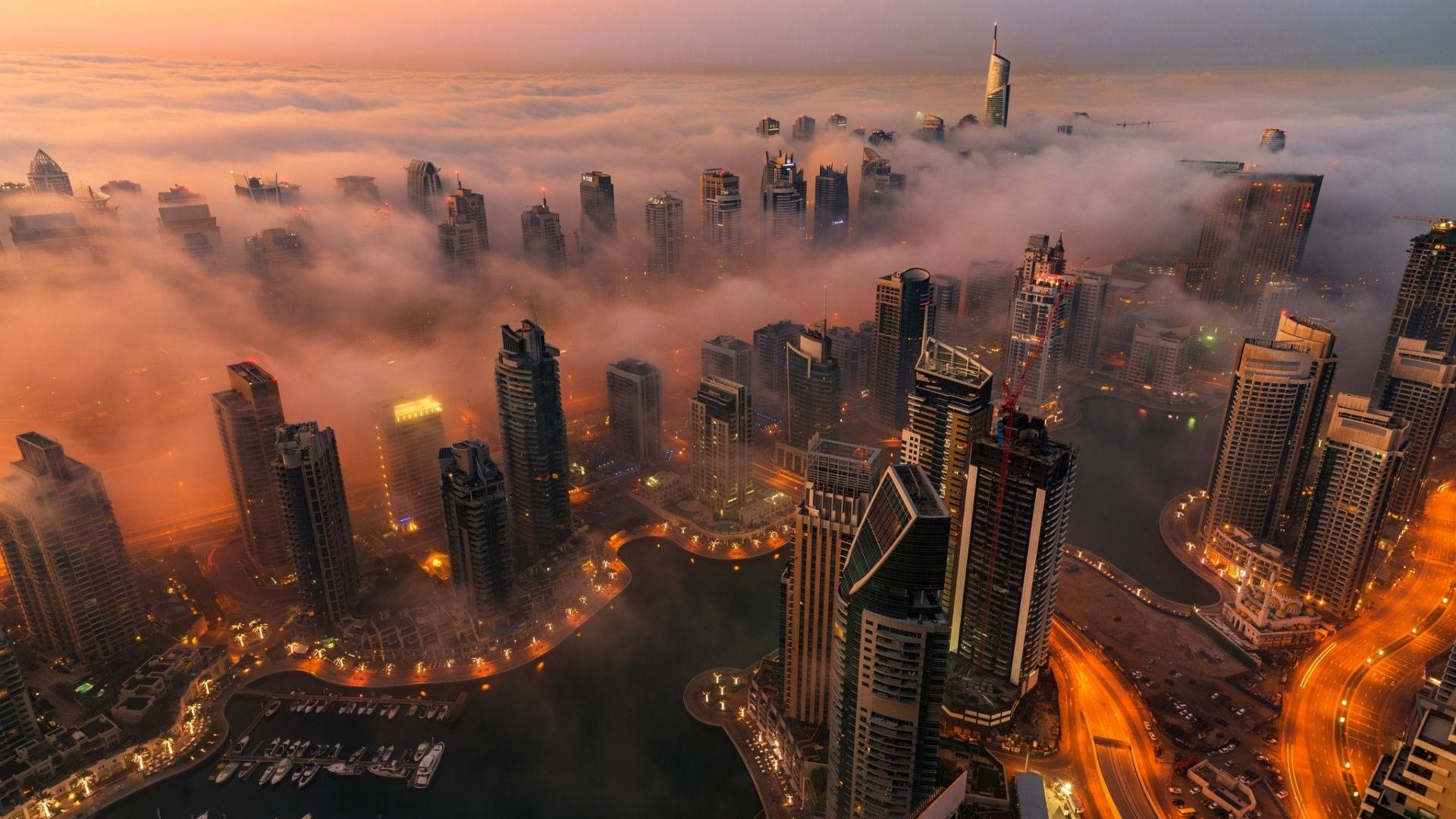 A Majestic View Of A Foggy Dubai City Background