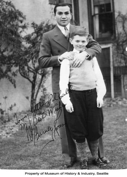 A Man And A Boy Standing Next To Each Other Background