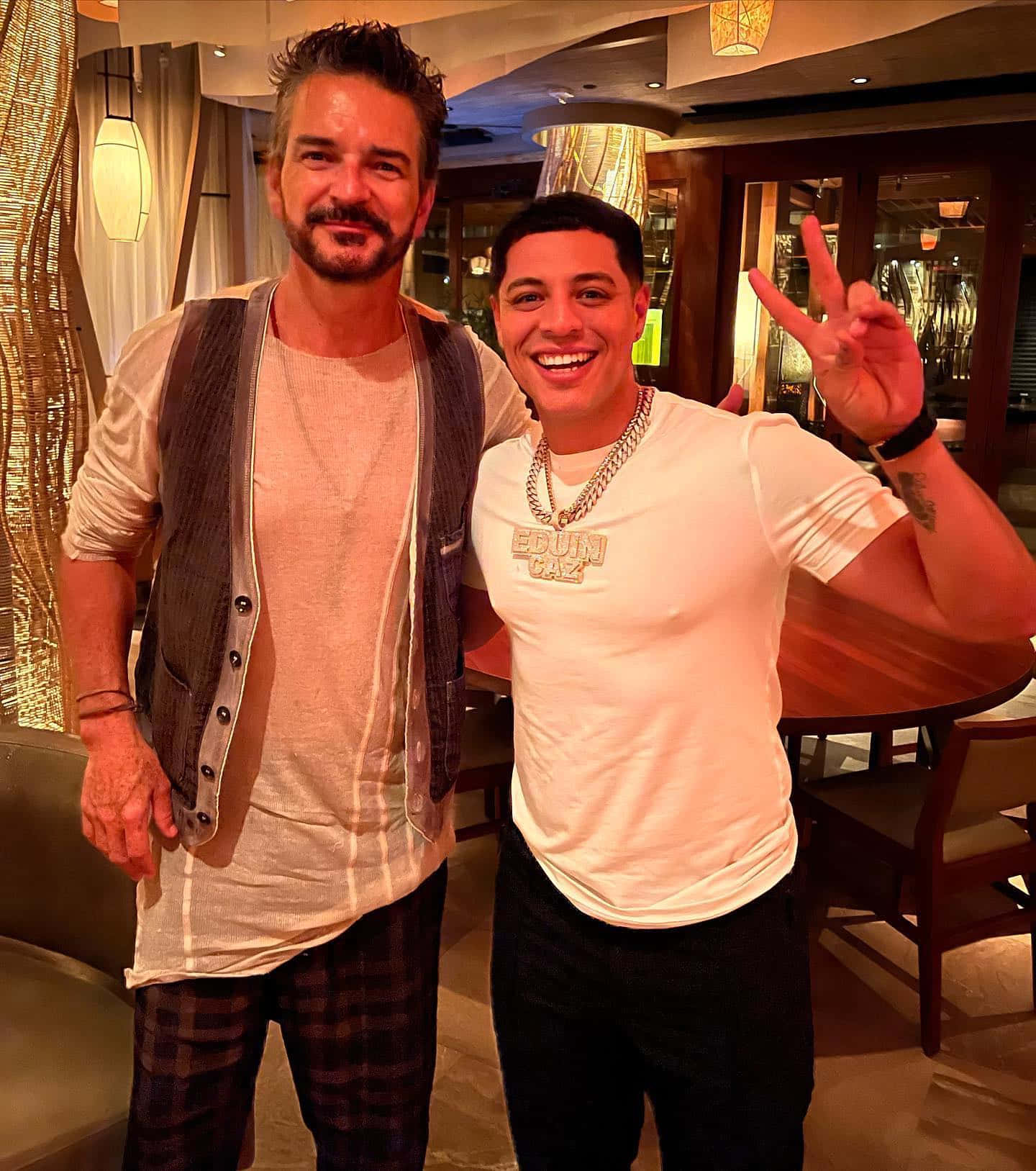 A Man And A Woman Standing Next To Each Other Background