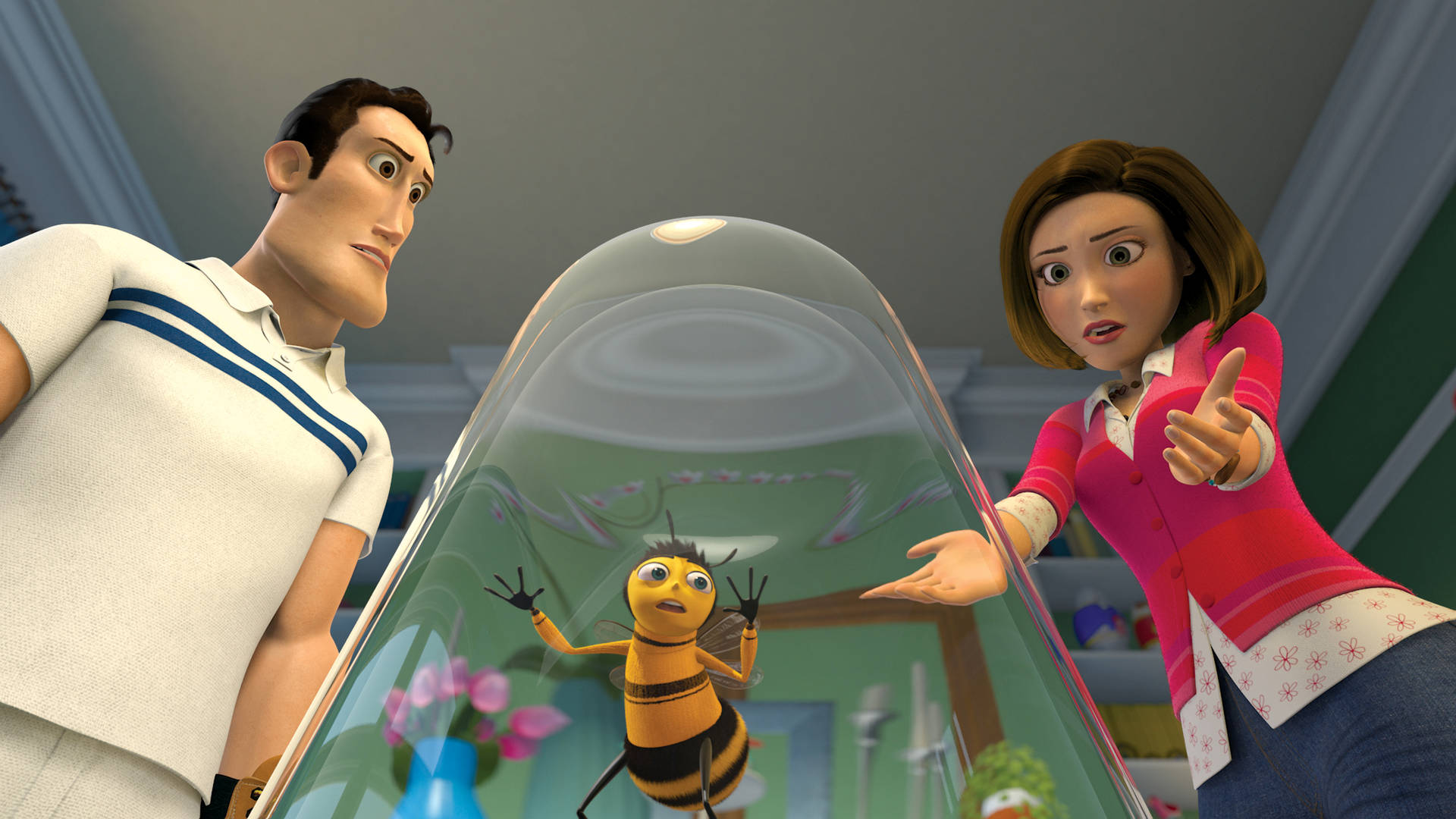 A Man And Woman Are Standing Next To A Bee In A Glass