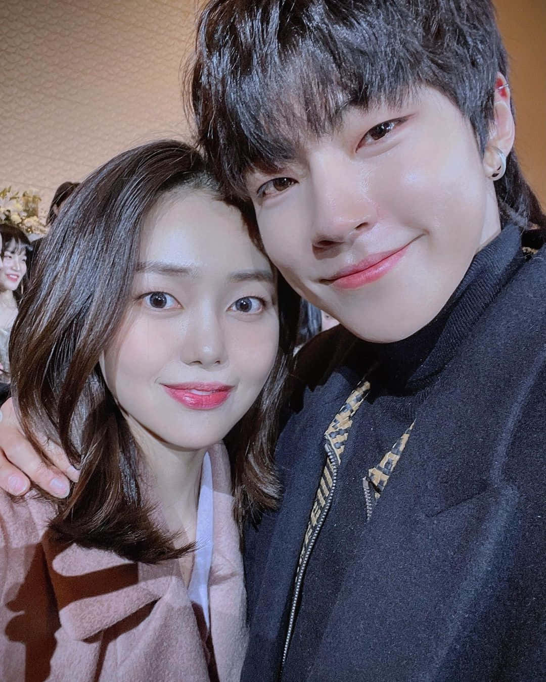 A Man And Woman Posing For A Photo Background