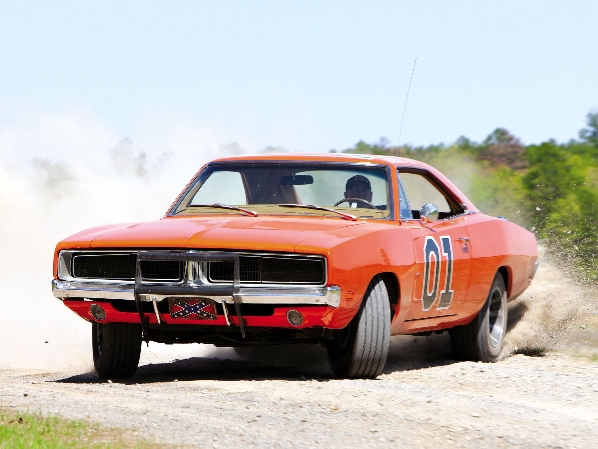 A Man Driving A Car Background