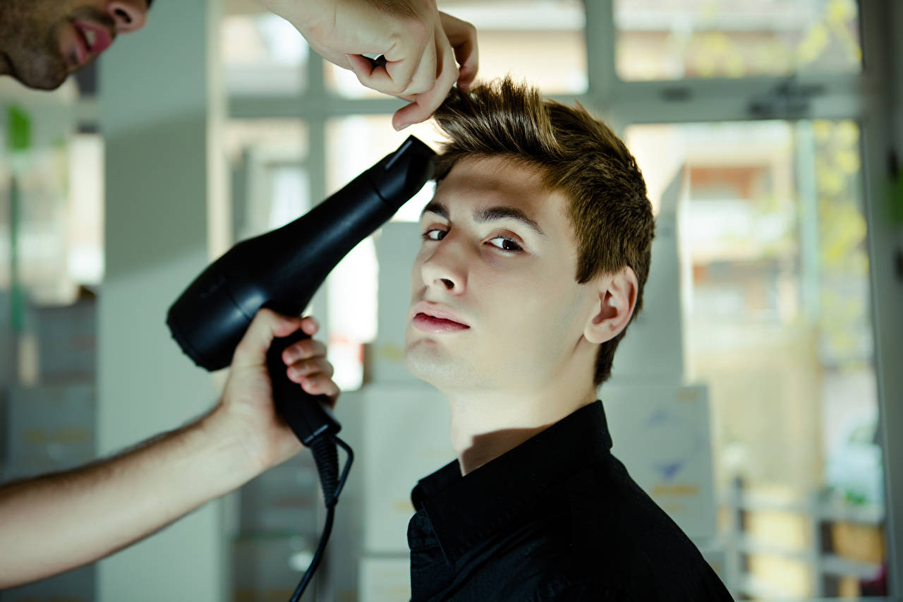 A Man Experiencing A Professional Hairstyling Session Aiming For A Fashionable Cowlick Style. Background