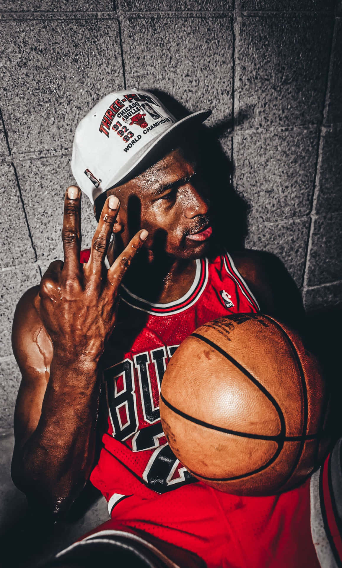 A Man Holding A Basketball With His Fingers Up Background