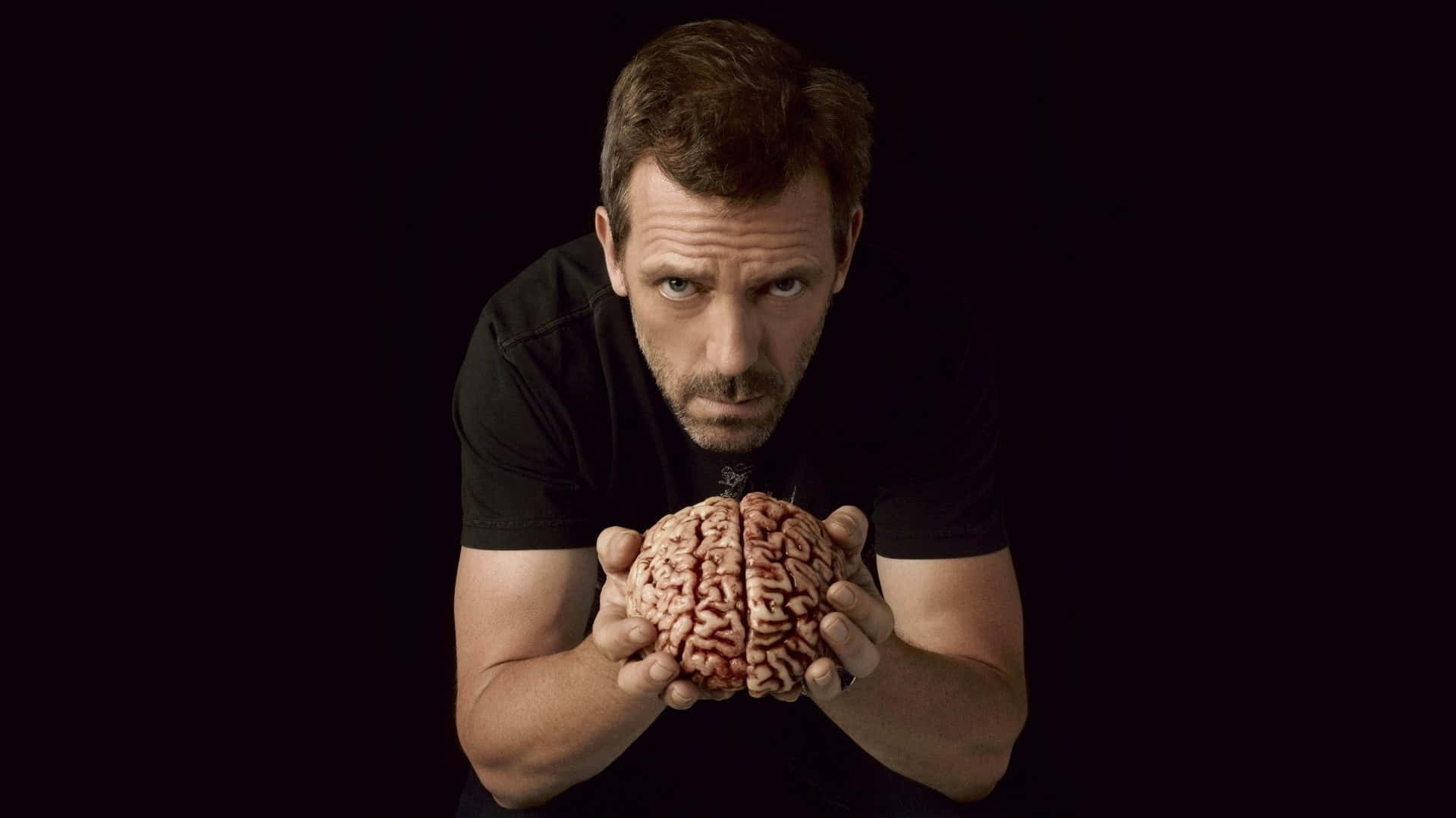 A Man Holding A Brain With His Hands Background