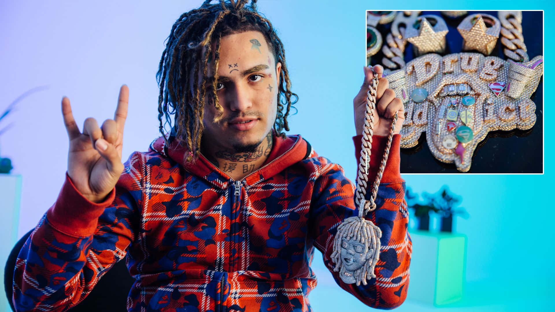 A Man Holding A Necklace With A Peace Sign Background