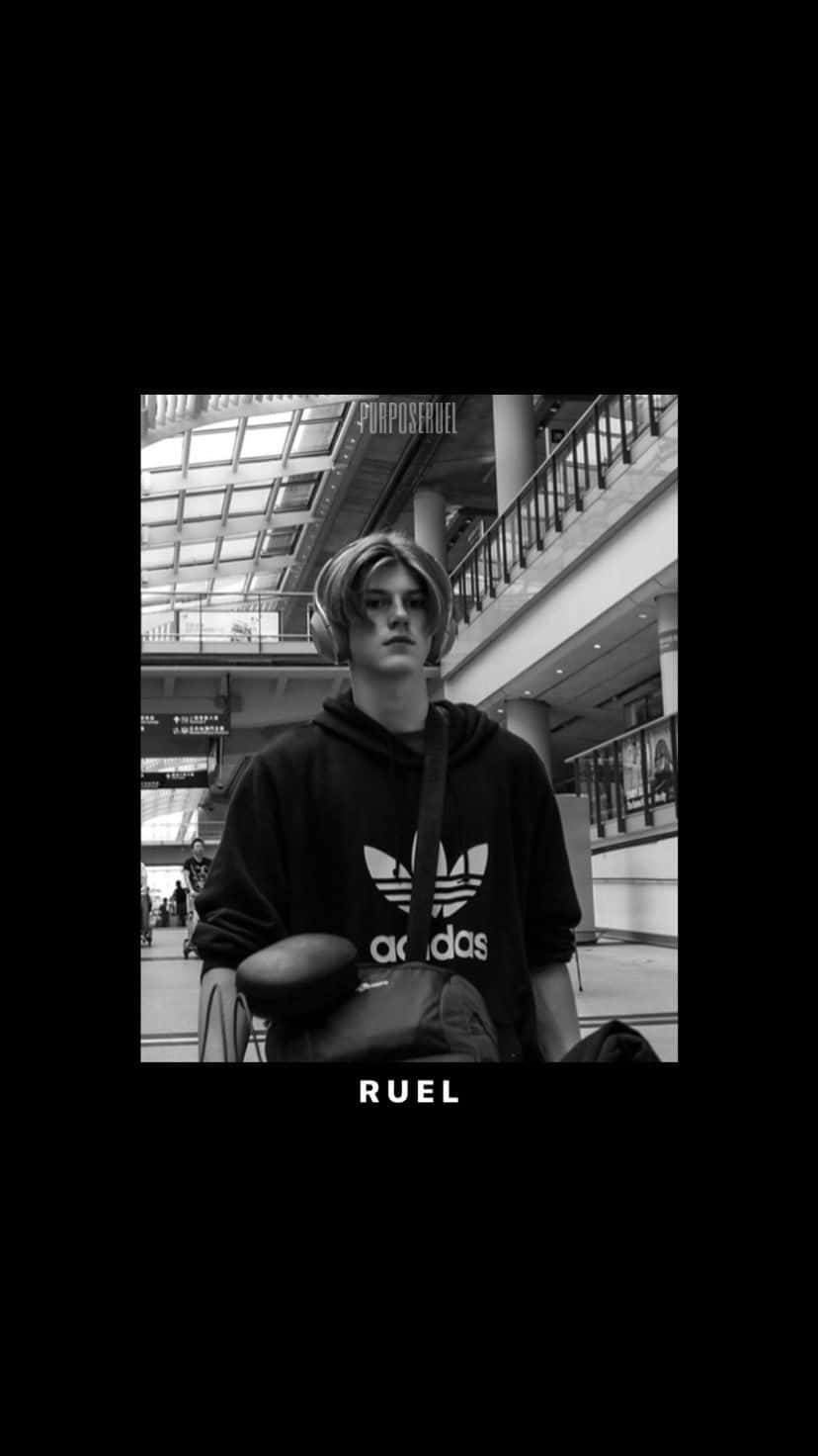 A Man In A Black And White Photo With The Word Rule Background