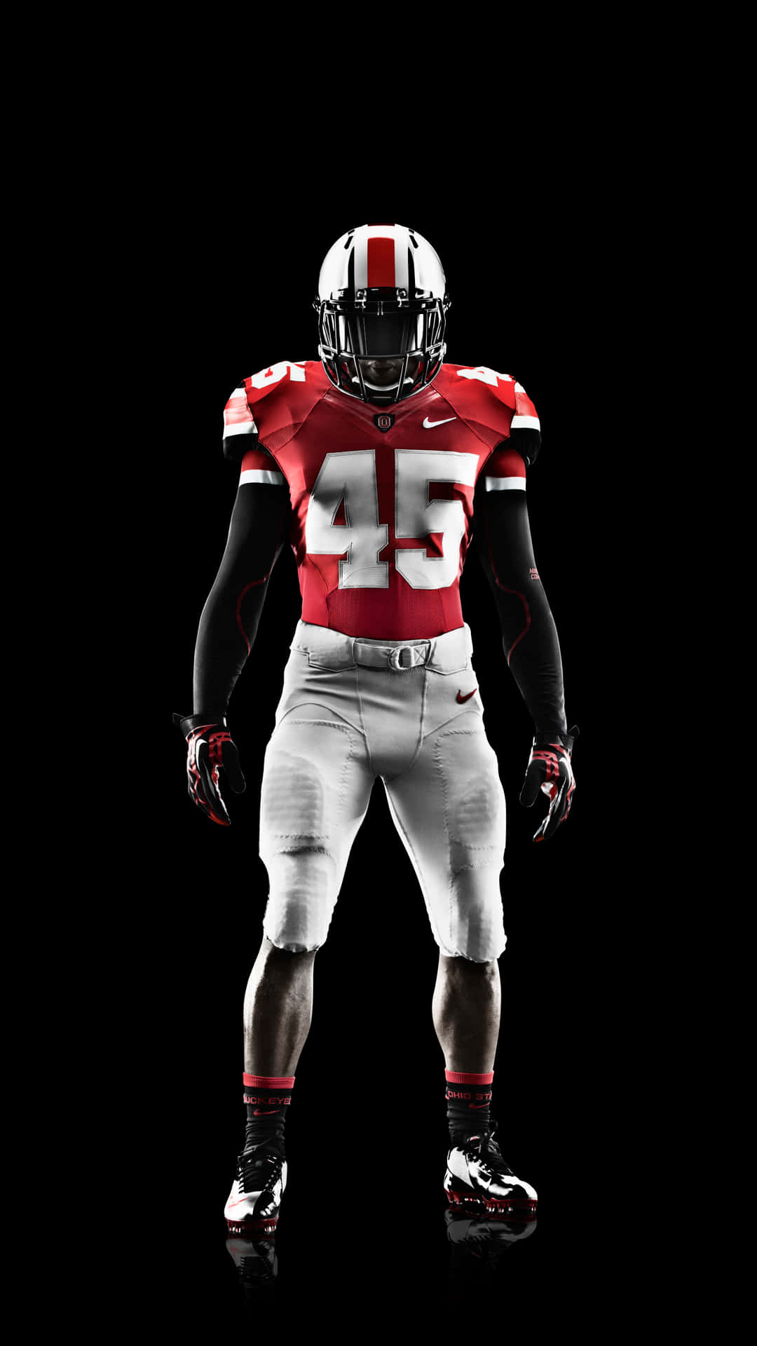 A Man In A Football Uniform Standing On A Black Background Background