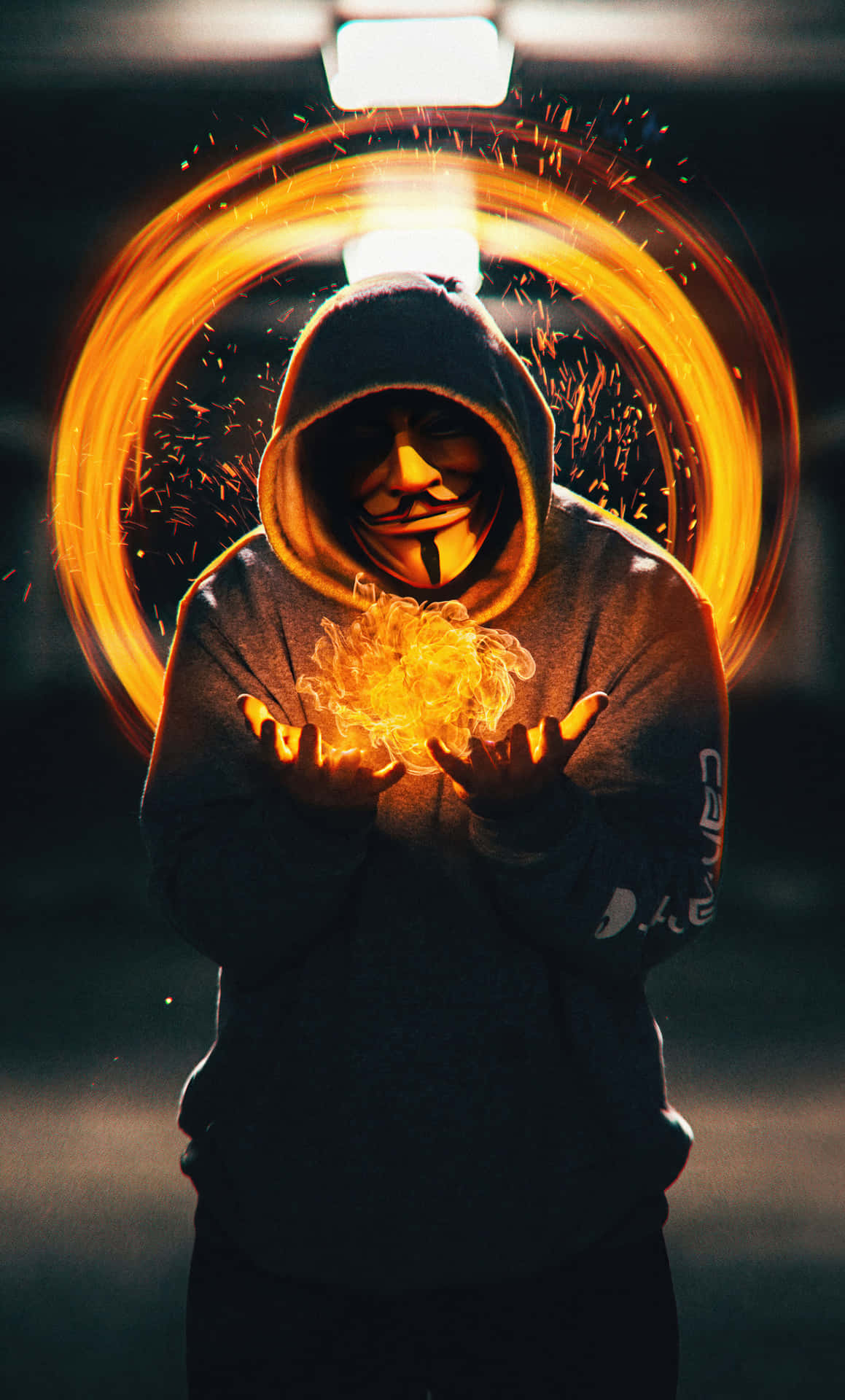 A Man In A Hoodie Holding A Fire Background