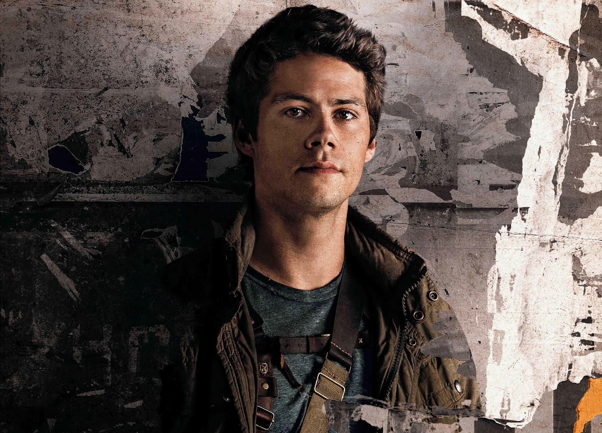 A Man In A Jacket Standing Next To A Wall Background