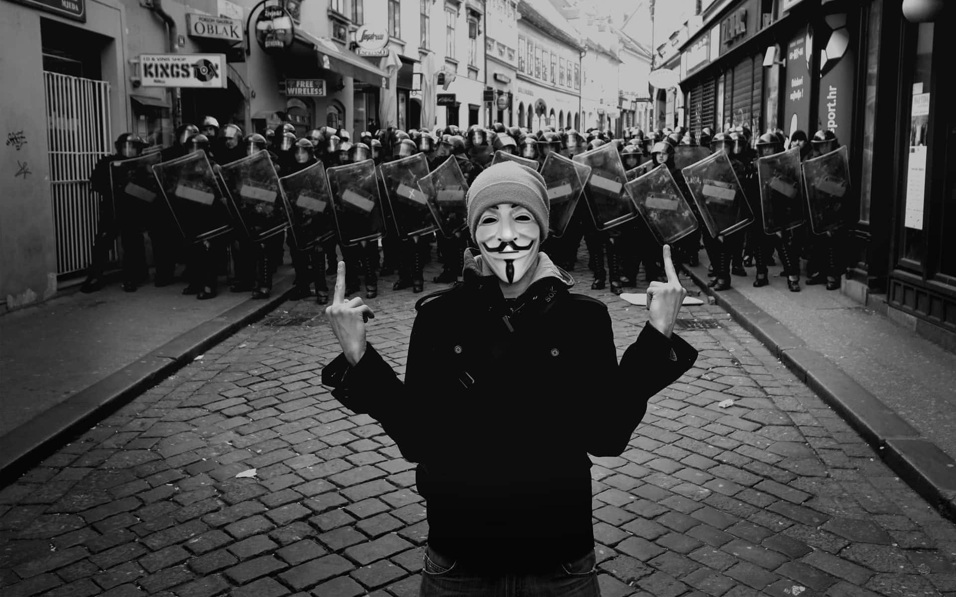 A Man In A Mask Standing In Front Of A Group Of Soldiers Background