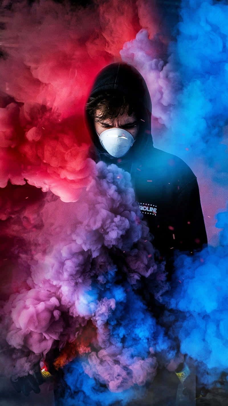 A Man In A Mask With Smoke Coming Out Of His Face Background
