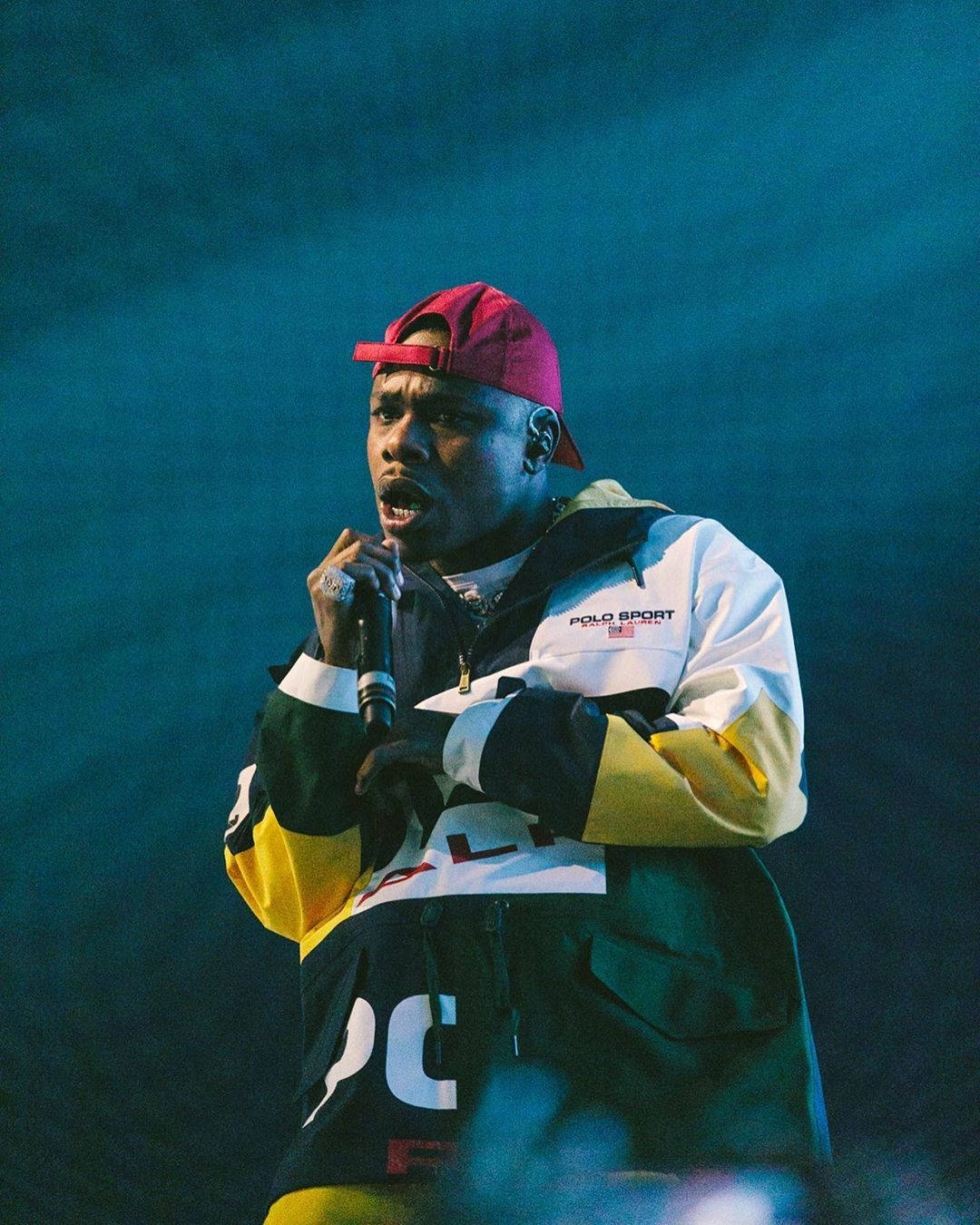 A Man In A Red Jacket And Hat Background