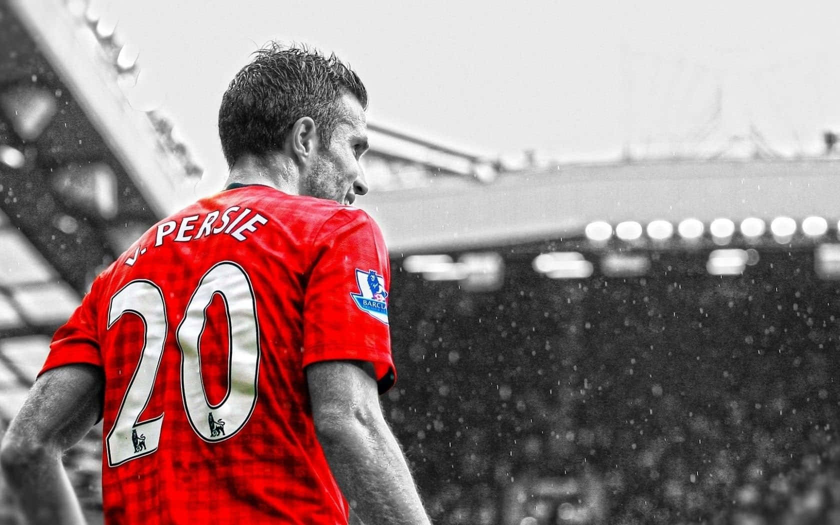 A Man In A Red Shirt Is Standing In The Rain Background