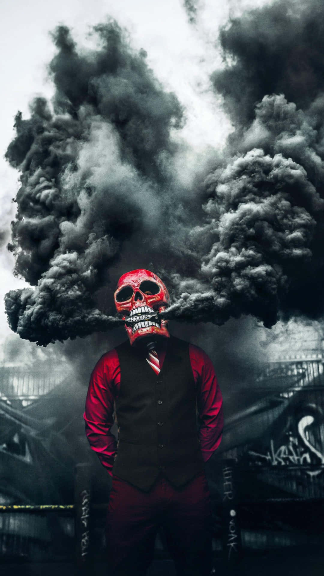 A Man In A Red Suit Standing In Front Of A Black Smoke Background