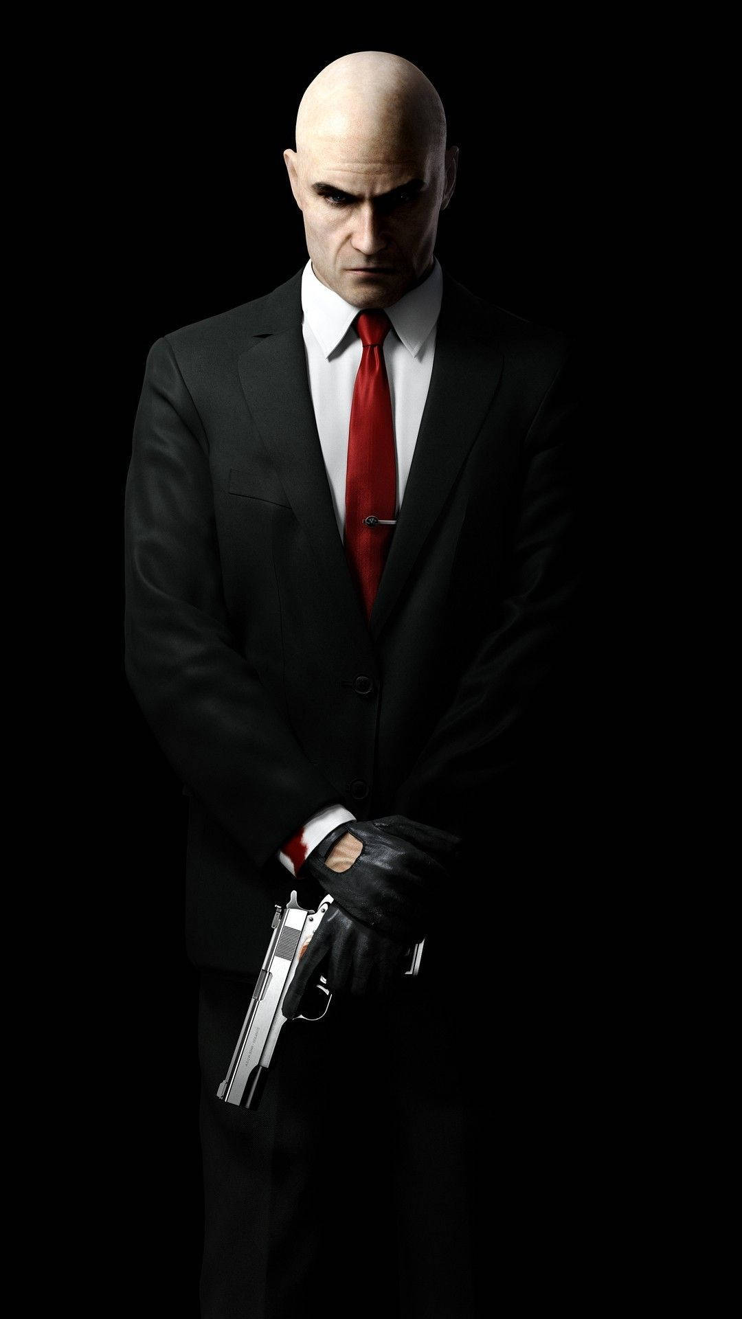 A Man In A Suit And Tie Holding A Gun Background