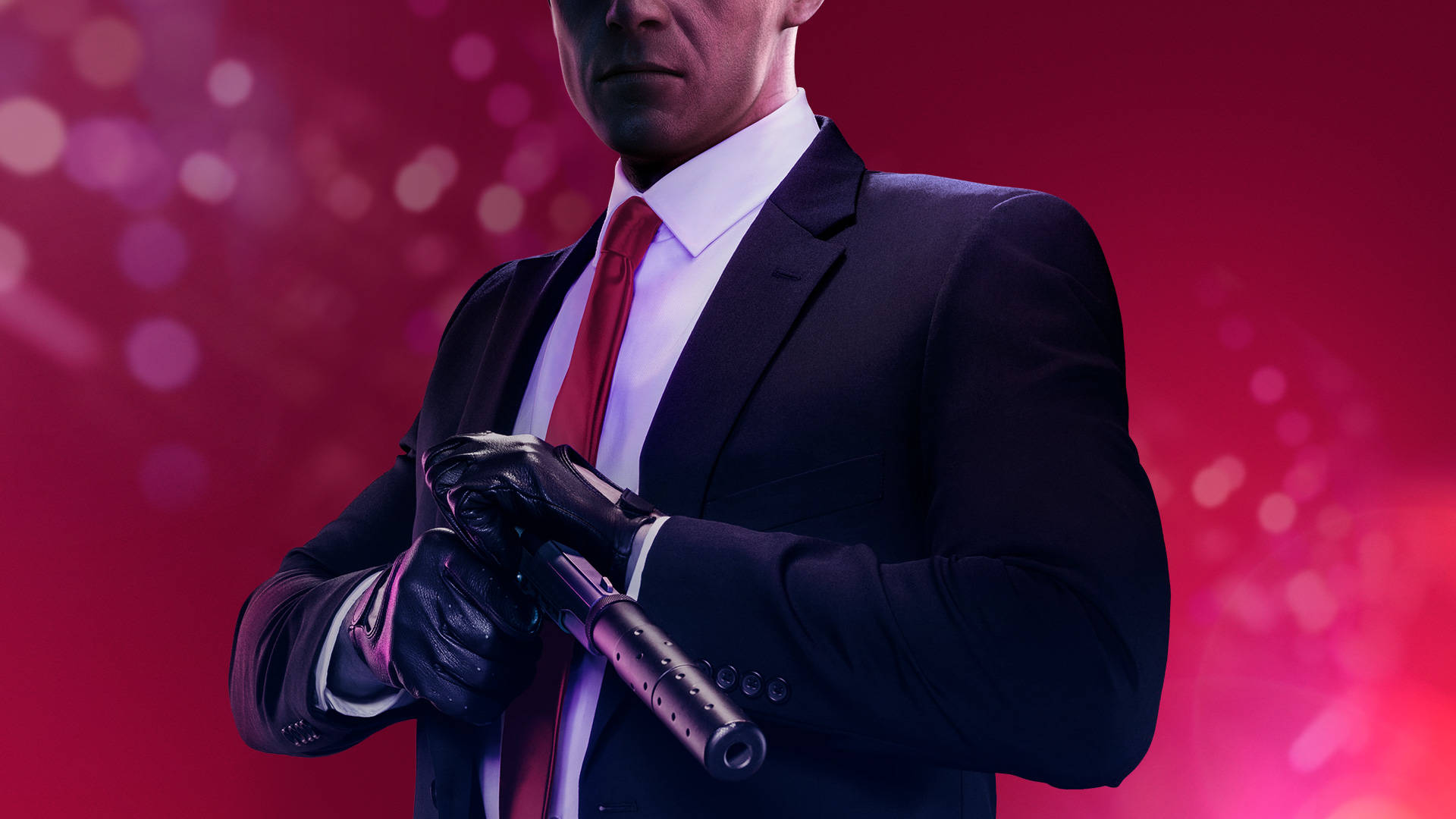 A Man In A Suit Holding A Gun