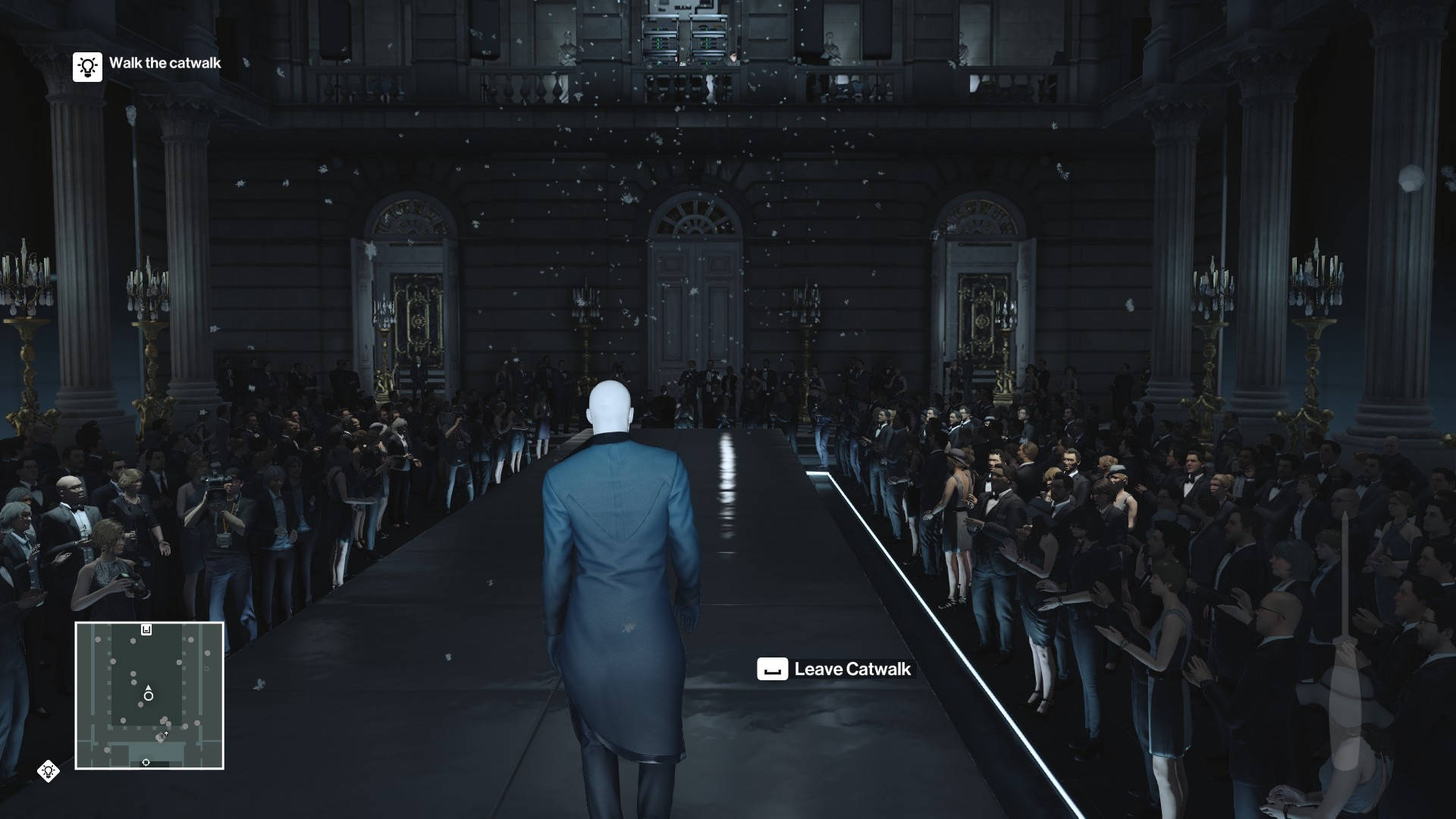 A Man In A Suit Walks Down The Runway Background