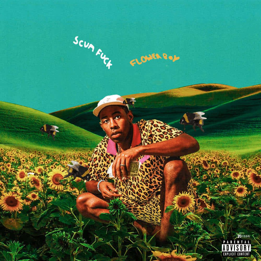 A Man In A Yellow Shirt Is Sitting In A Field Of Sunflowers Background