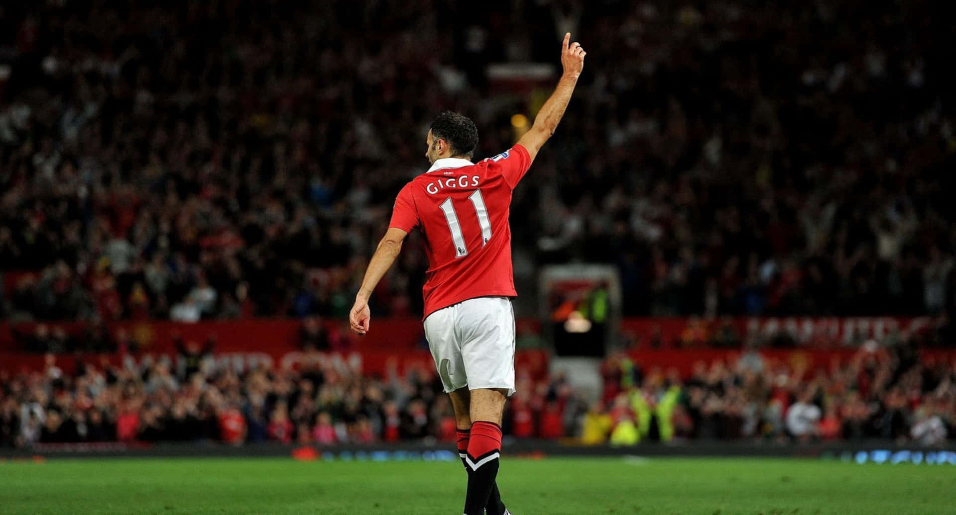 A Man In Red Shirt Is Celebrating His Goal Background