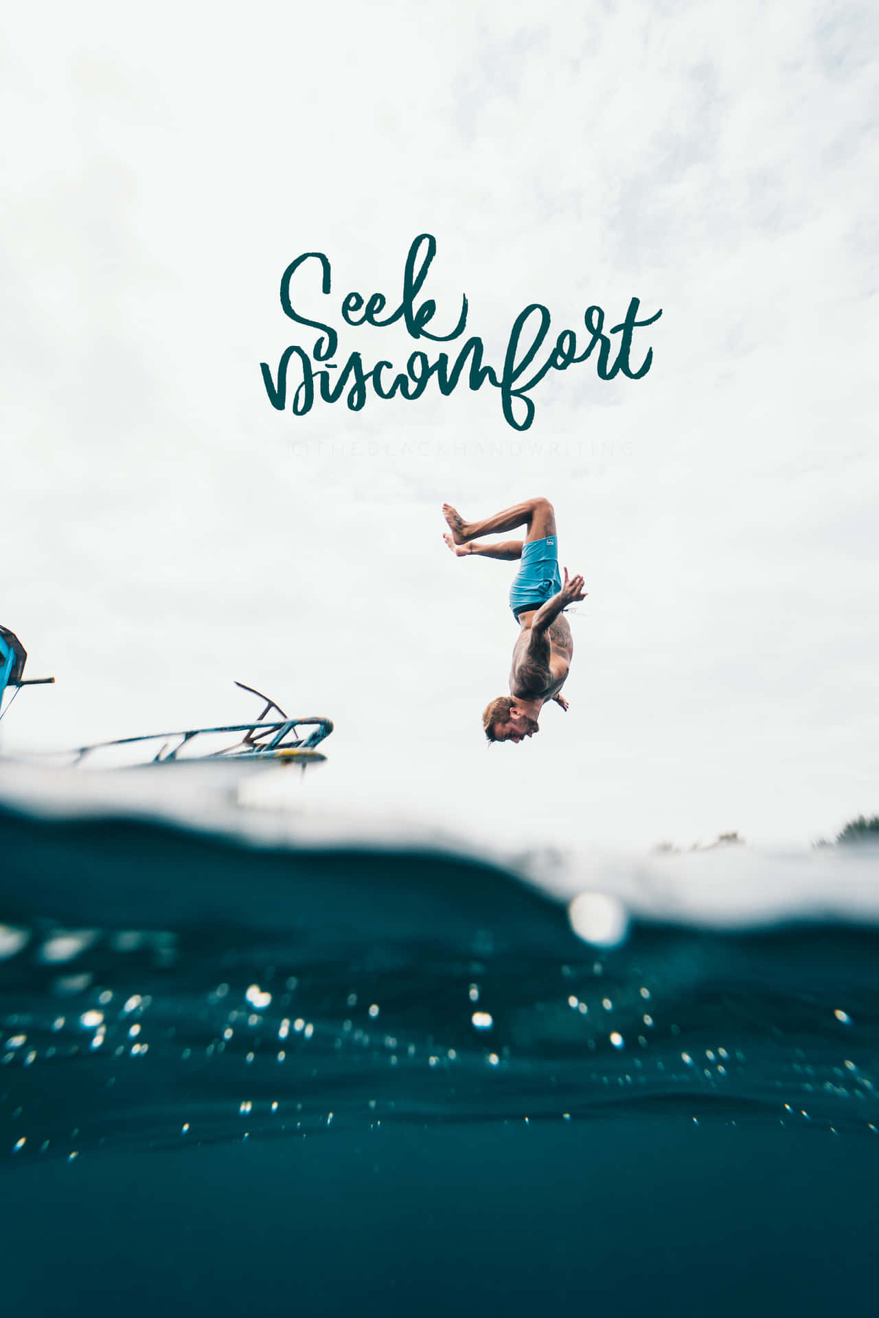 A Man Is Diving Into The Ocean With The Words Seek Visionfort Background