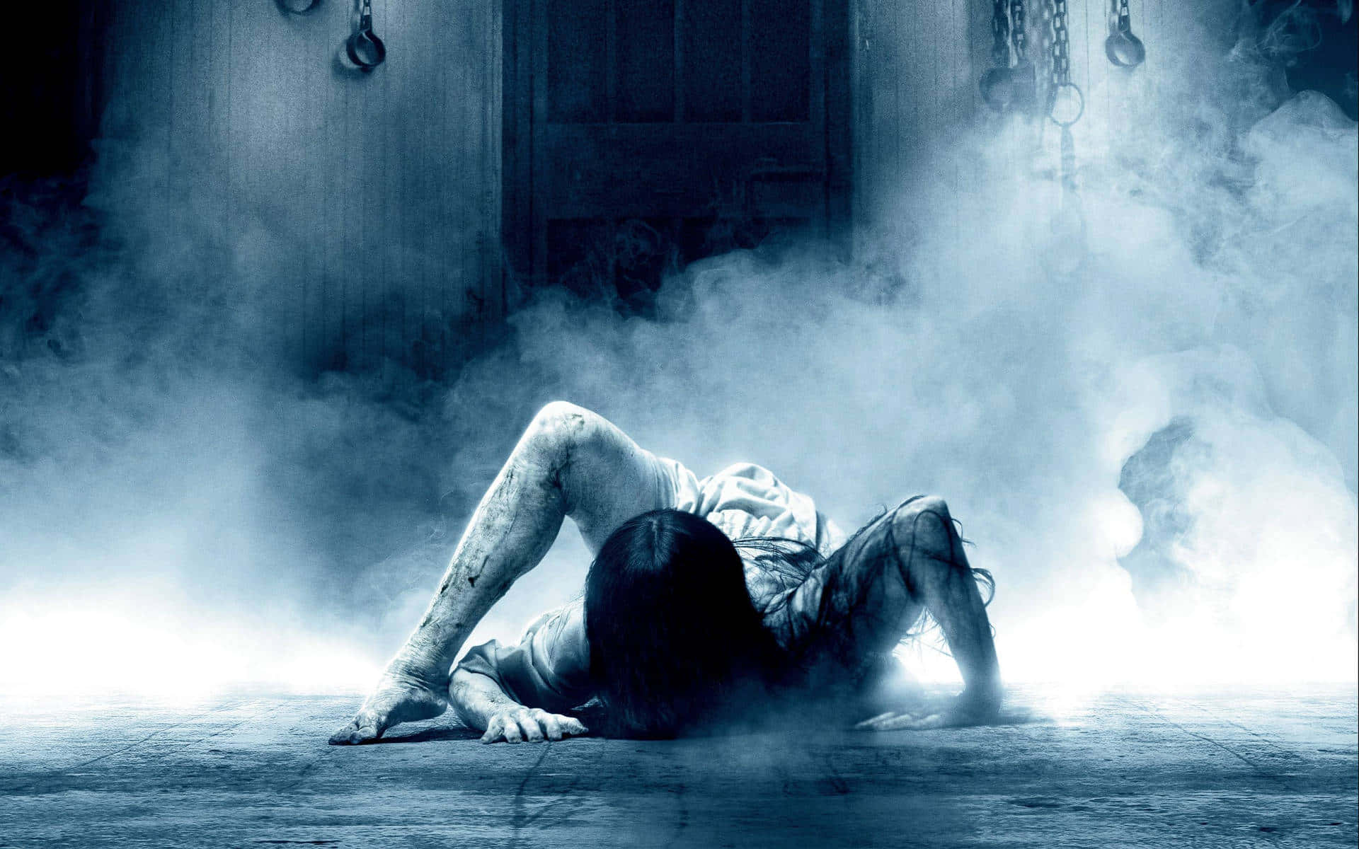 A Man Is Laying On The Floor In Front Of A Door Background