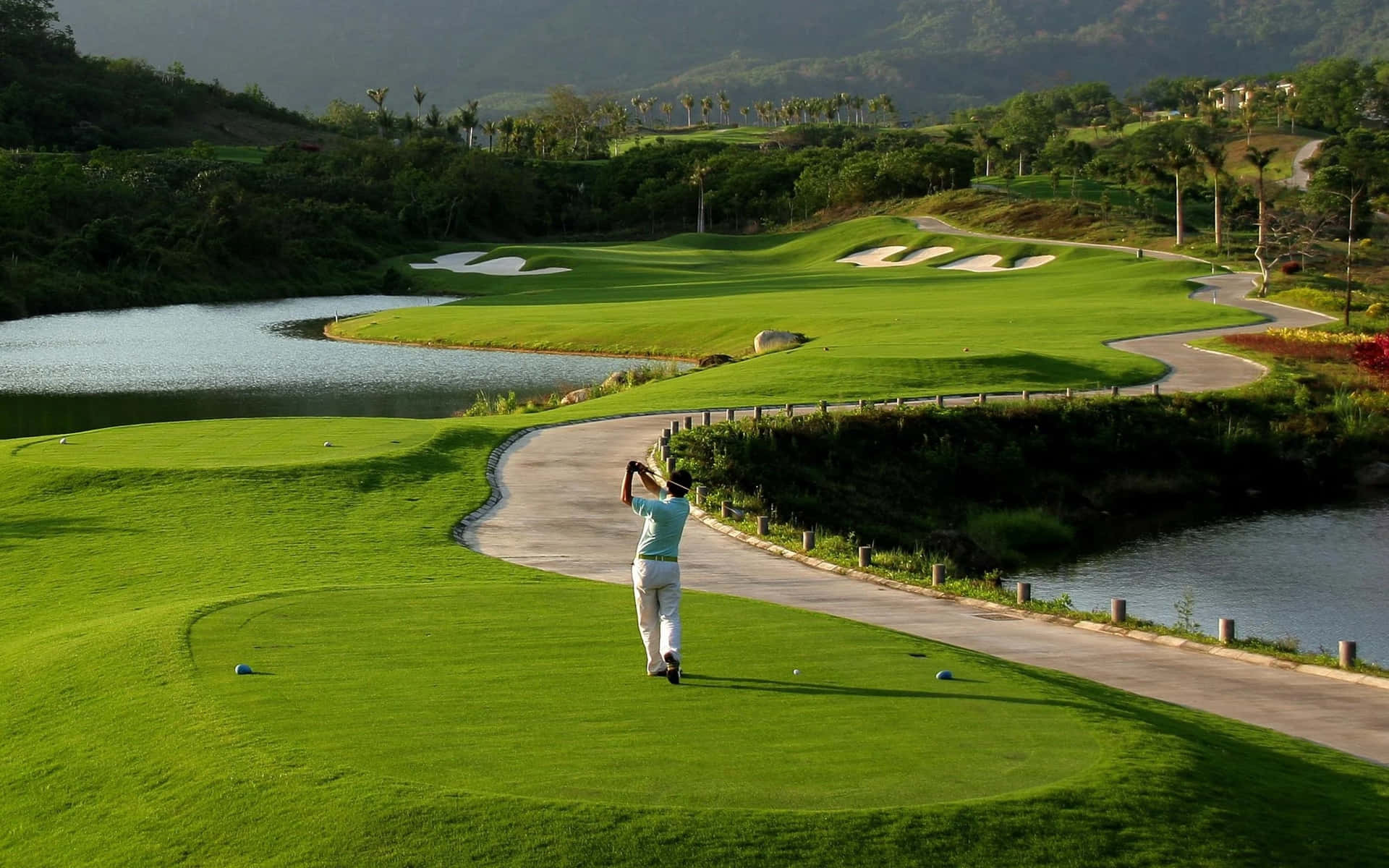 A Man Is Playing Golf On A Green Course Background