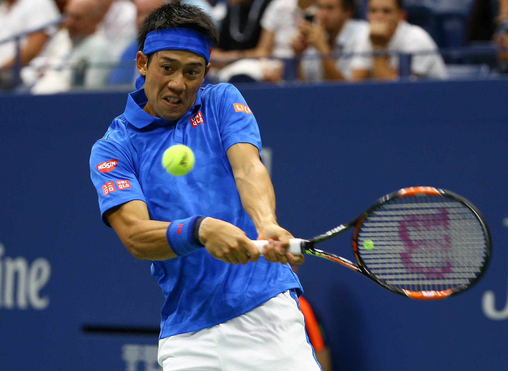 A Man Is Playing Tennis With A Racquet Background