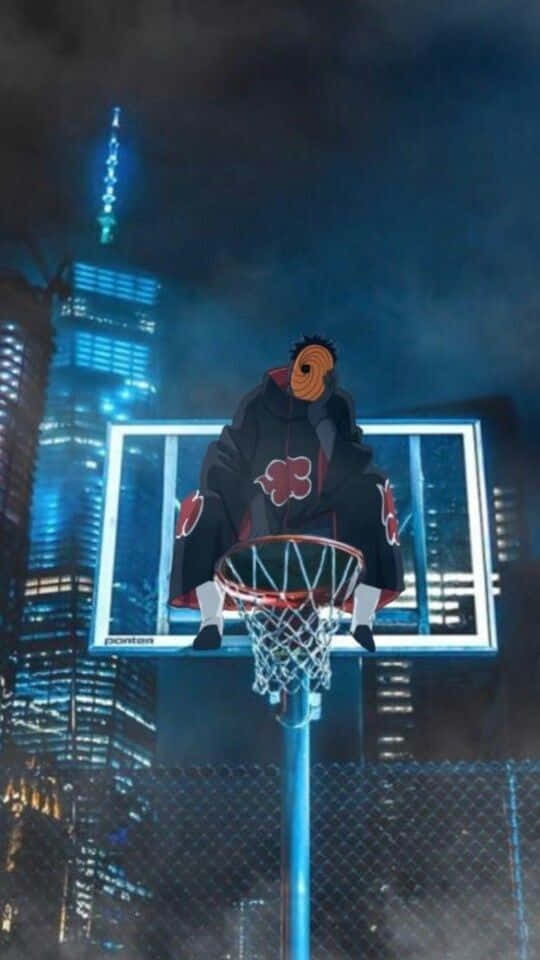 A Man Is Sitting On A Basketball Hoop In The Night Background