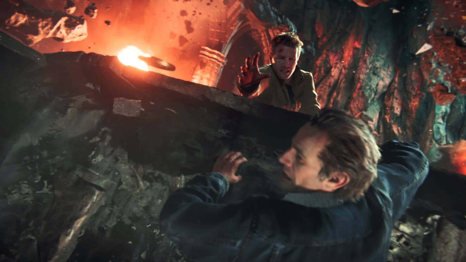 A Man Is Standing In A Cave With A Fire Background