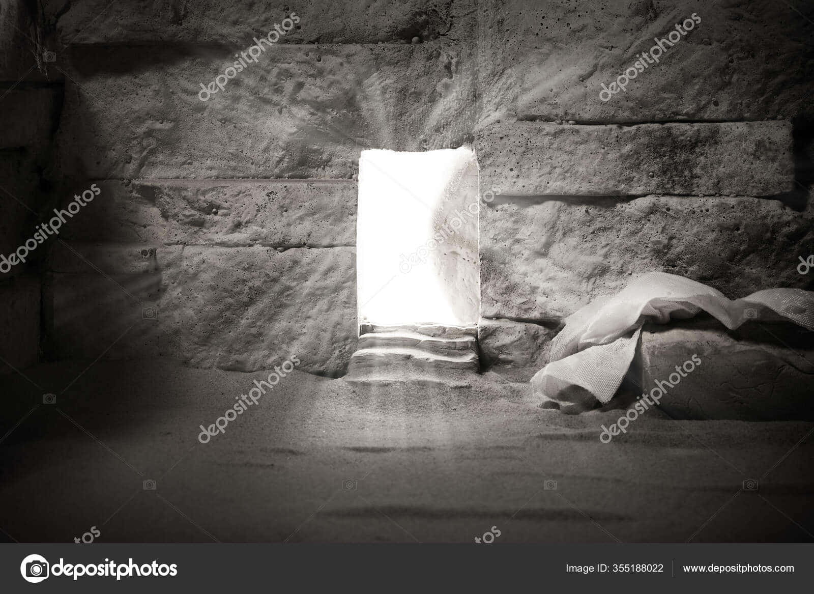 A Man Is Standing In A Cave With A Light Shining Through The Door Background