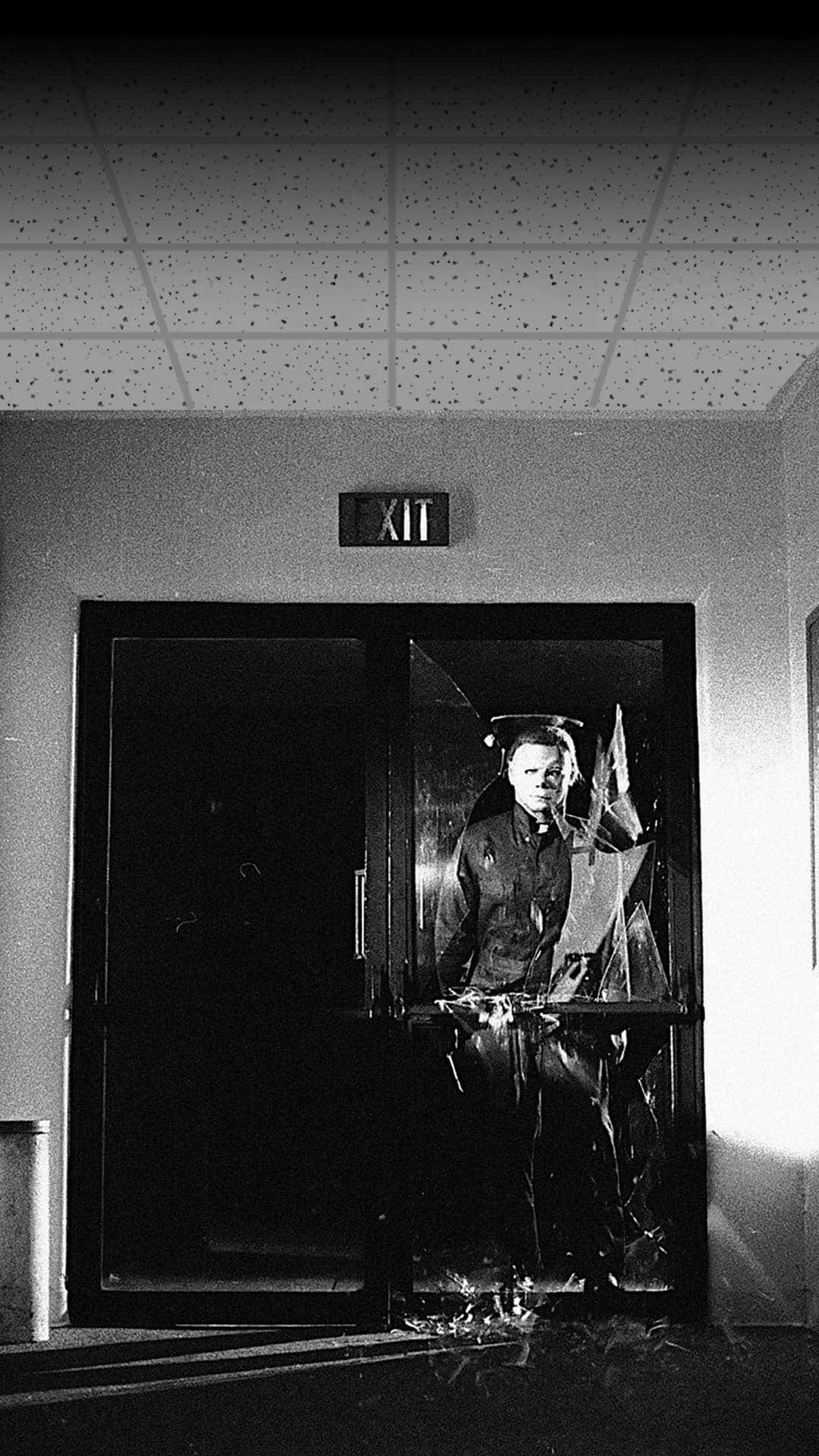 A Man Is Standing In A Doorway Background