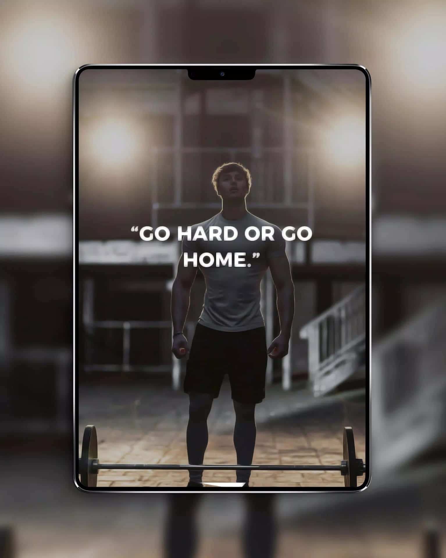 A Man Is Standing In Front Of A Tablet With The Words Go Hard Or Go Home Background