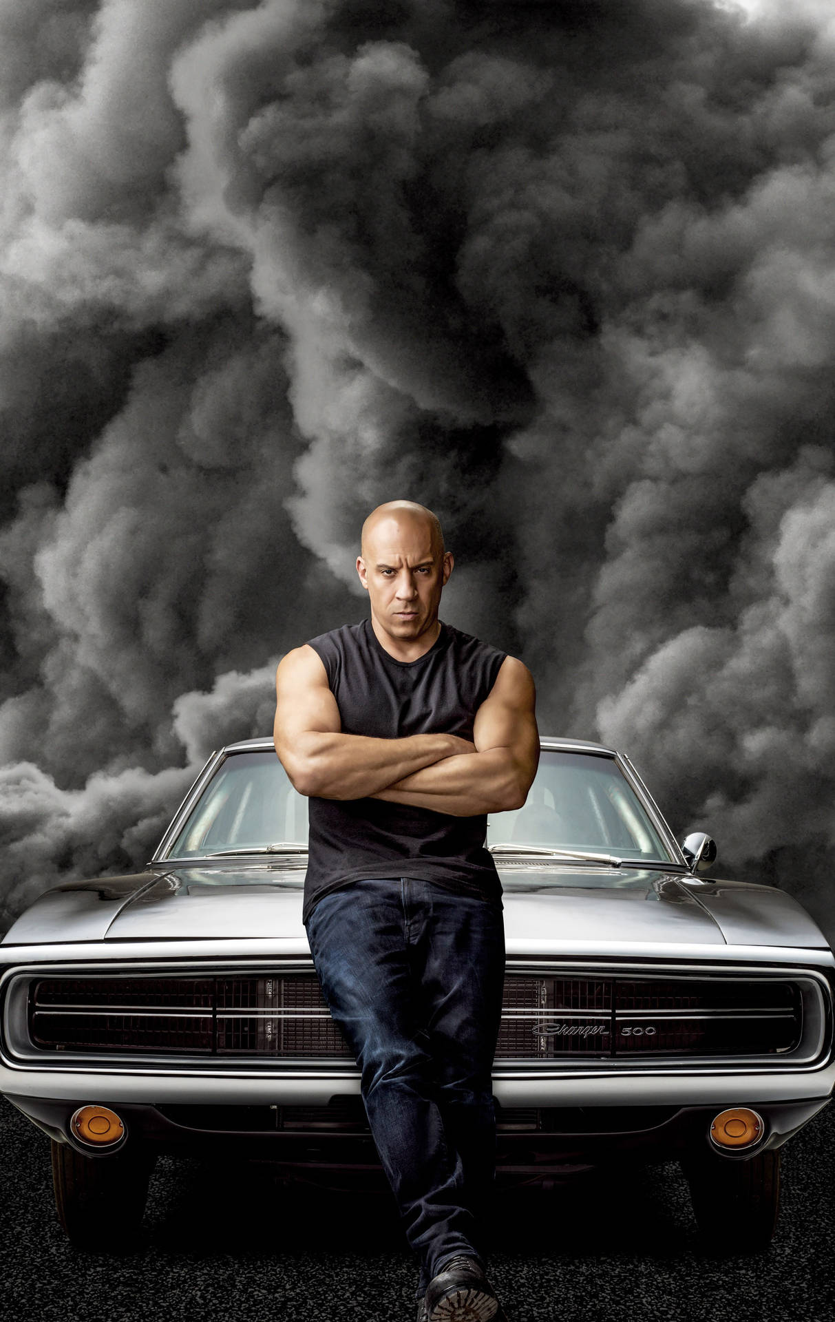 A Man Is Standing On A Car With Smoke Coming Out Of It Background