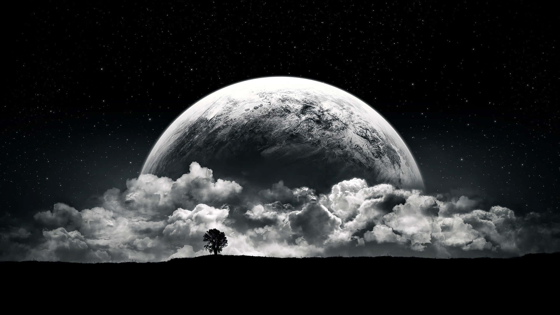 A Man Is Standing On A Hill With A Moon In The Background Background