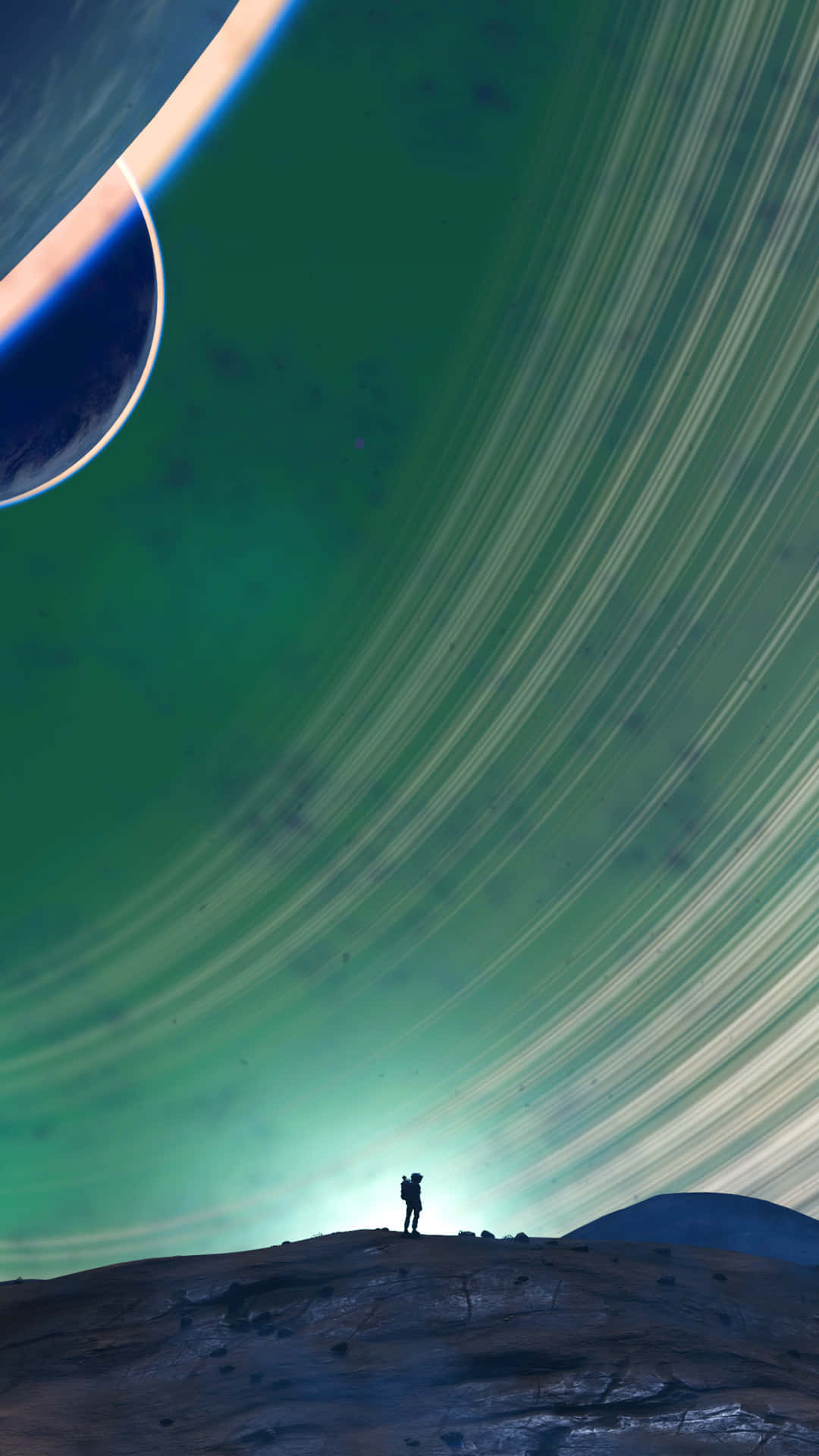 A Man Is Standing On A Hill With Two Planets In The Background Background