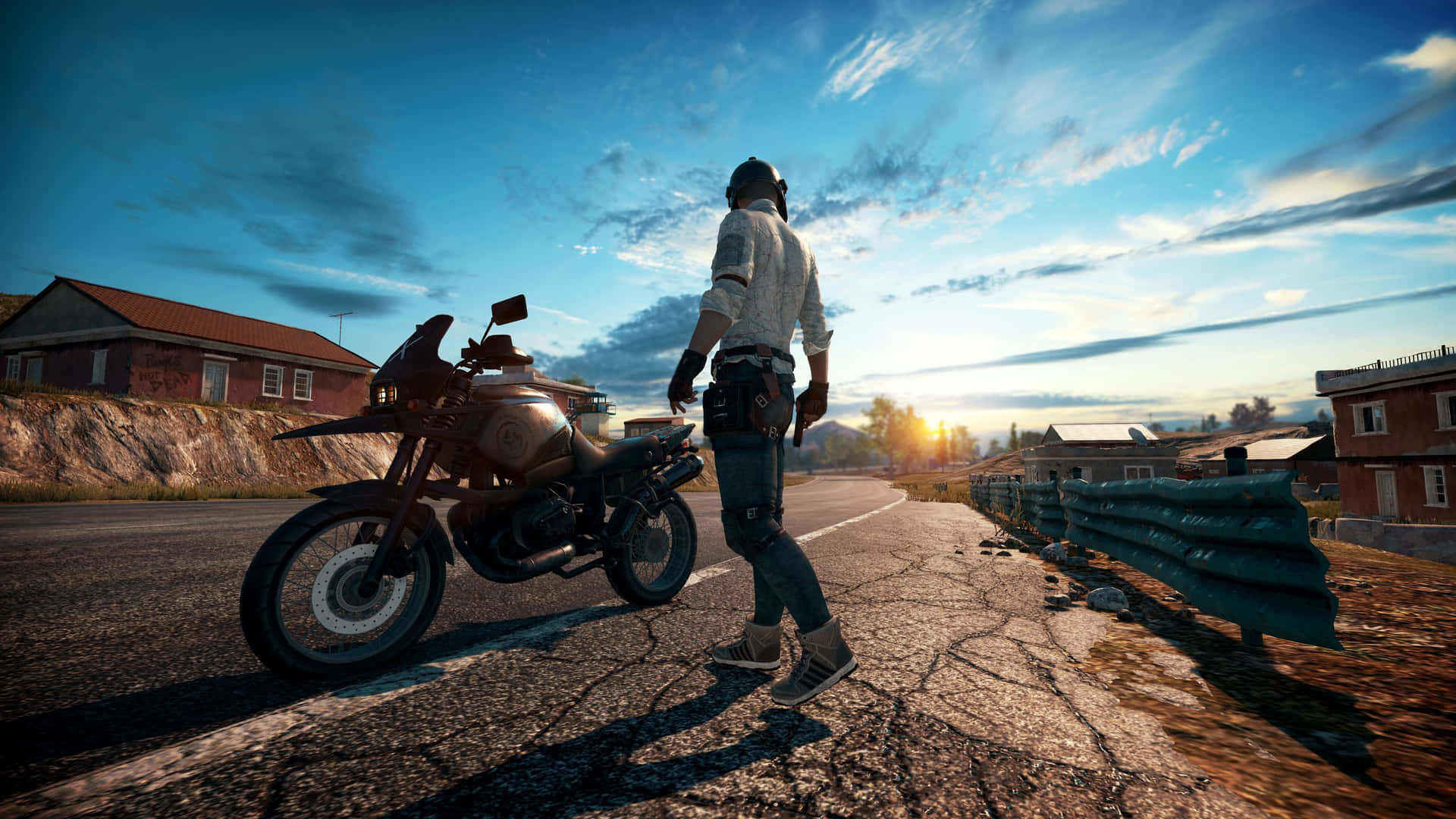 A Man Is Standing On A Road With A Motorcycle Background
