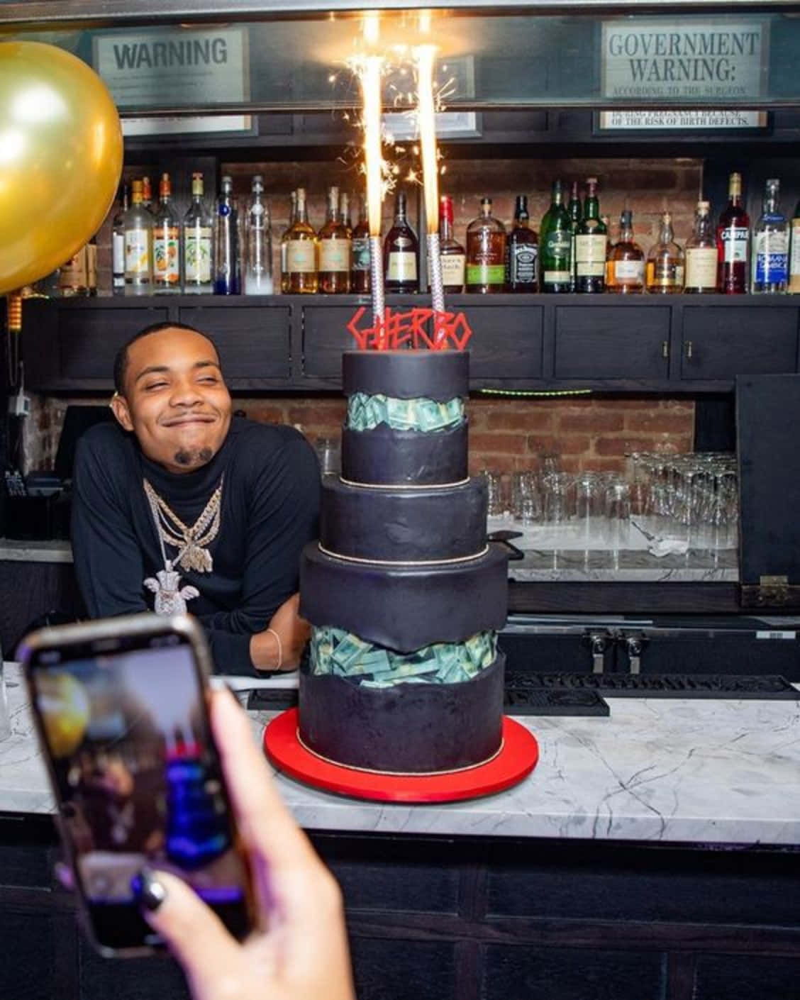 A Man Is Taking A Picture Of A Birthday Cake Background