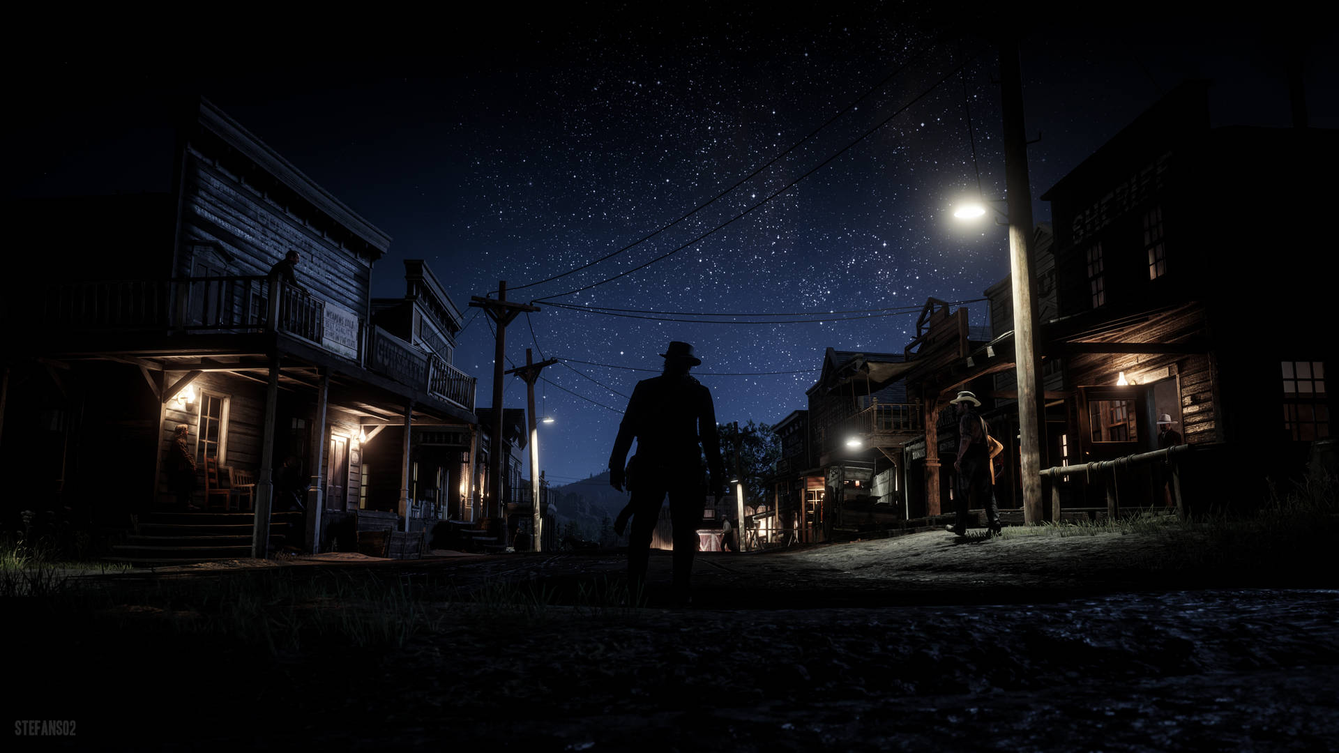 A Man Is Walking Down A Street At Night Background