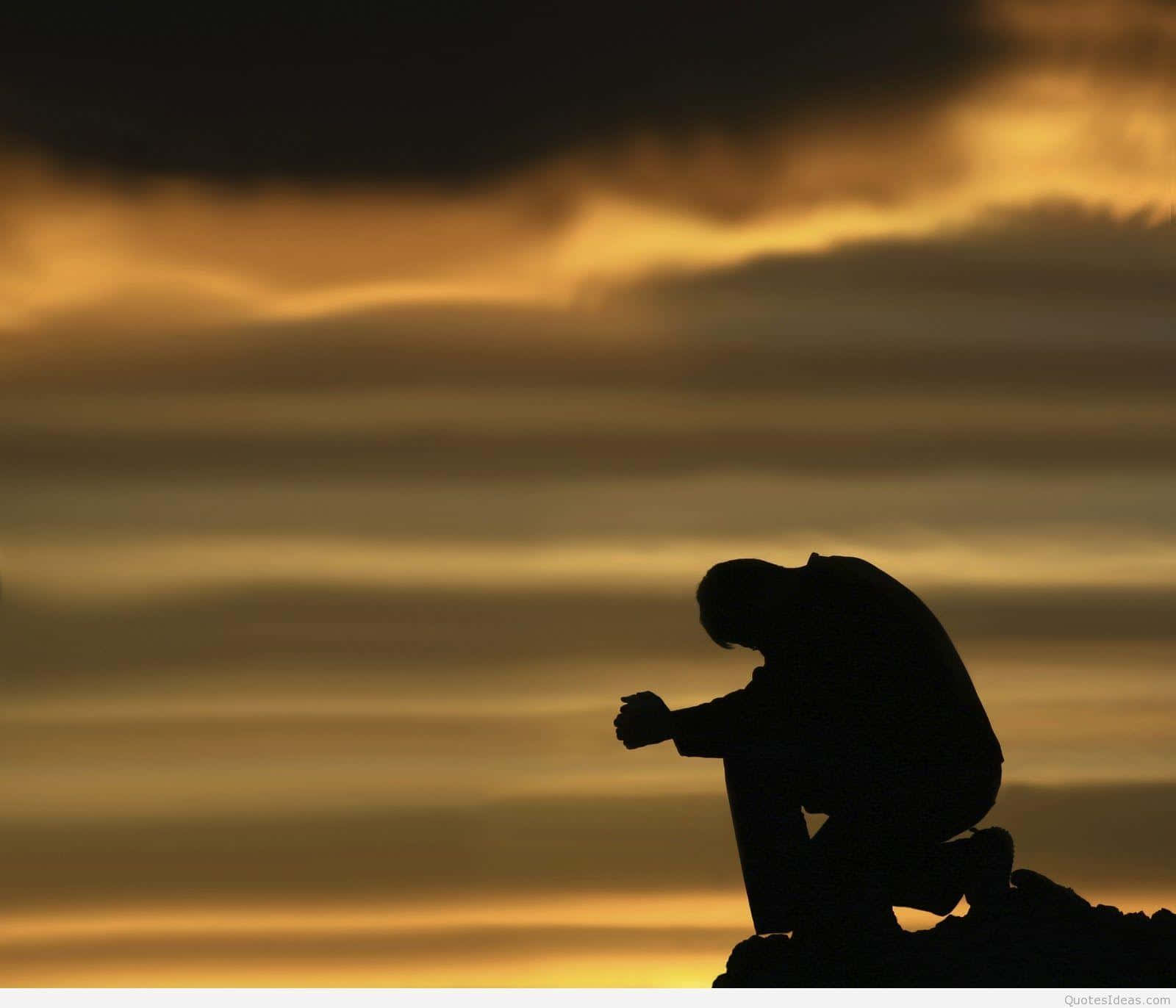 A Man Kneeling Down Background