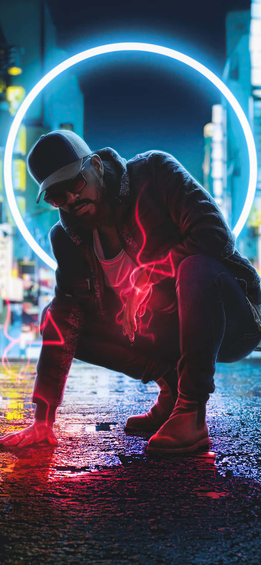 A Man Kneeling On The Street With A Neon Light