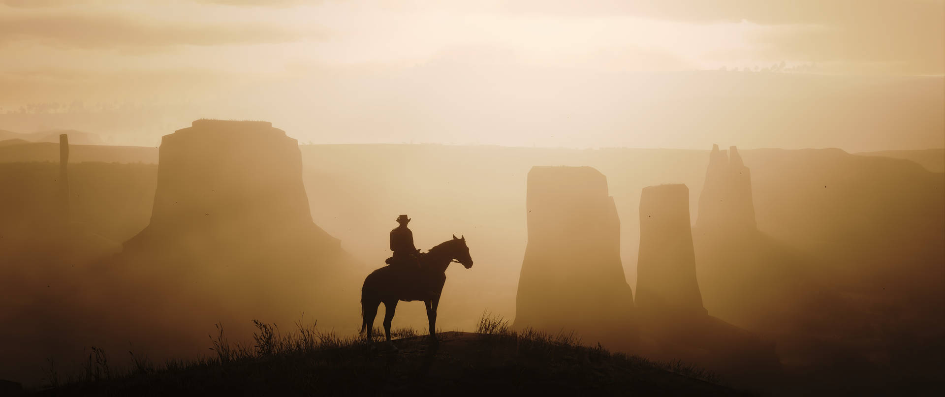 A Man On A Horse Is Standing On A Hill Background