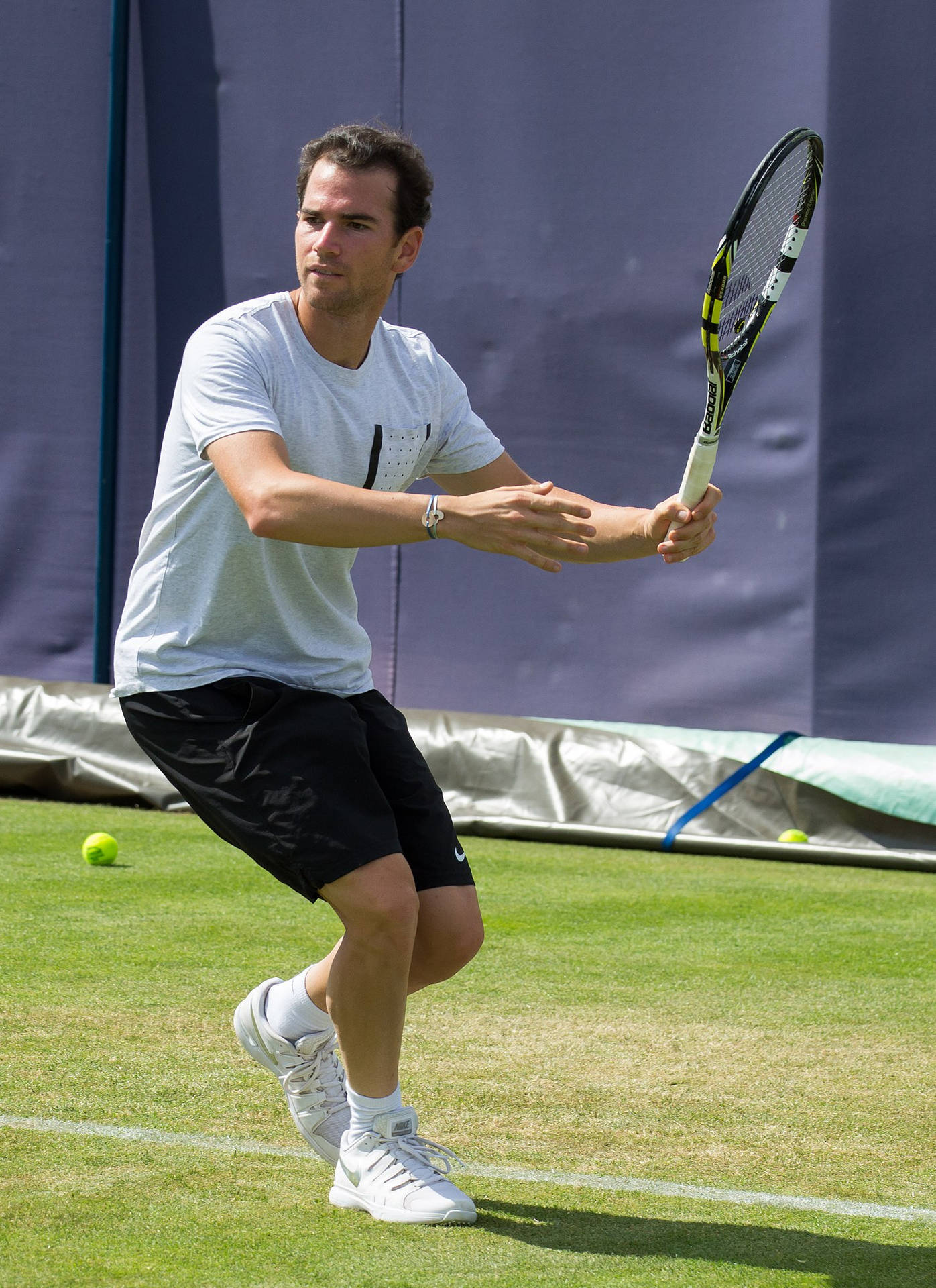 A Man Playing Tennis Background