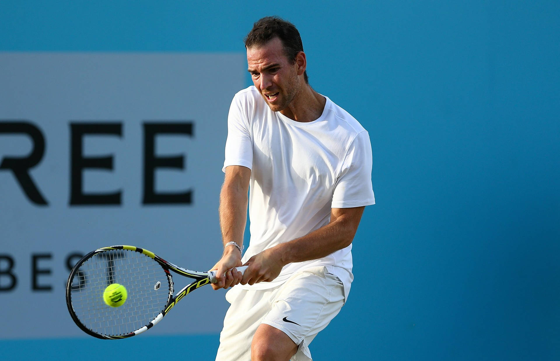 A Man Playing Tennis Background