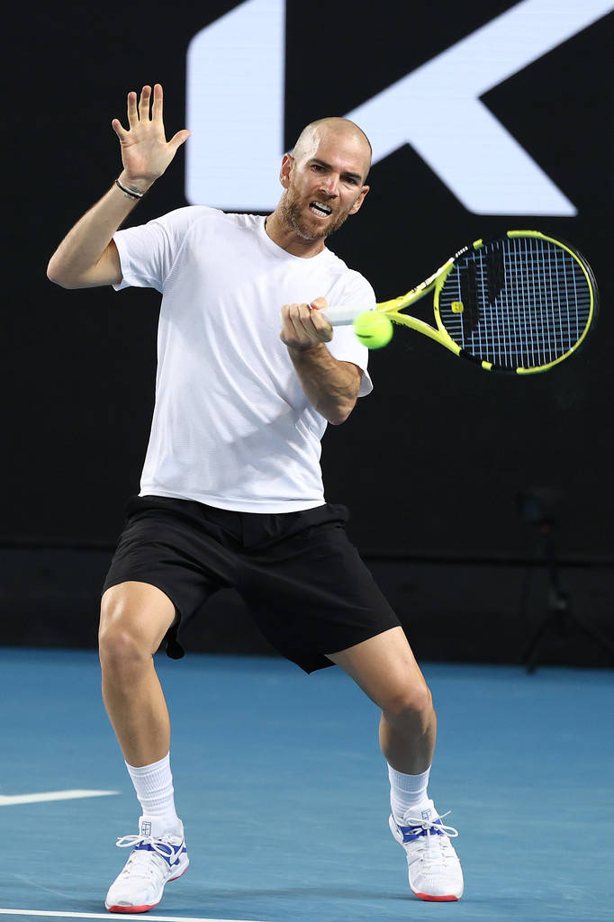 A Man Playing Tennis Background