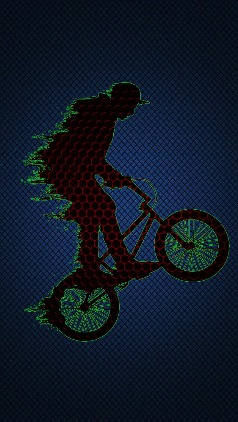 A Man Riding A Bike On A Dark Background